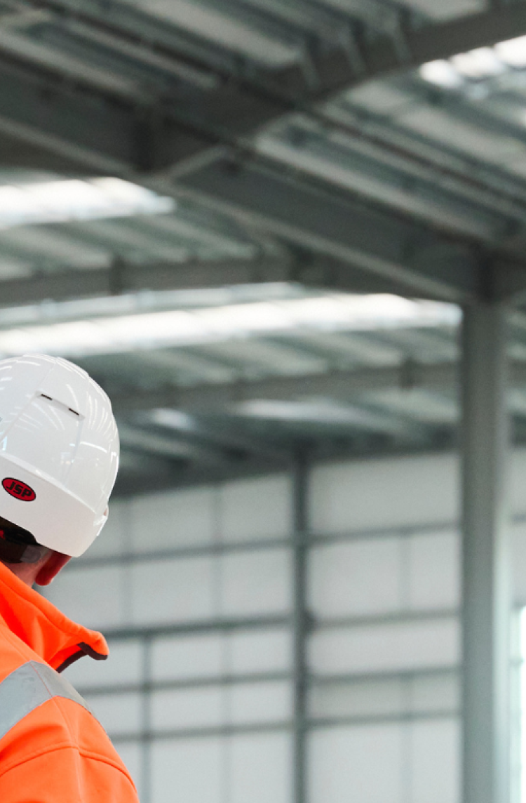 Person inspecting building