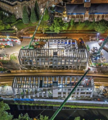 University station Birmingham under construction shot at night lit up