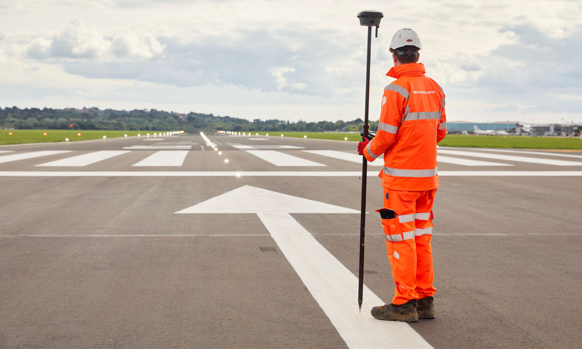 Man in high vis on runway